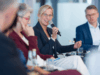 Frau Gerhardts auf einer Podiumsdiskussion_Berugspolitik